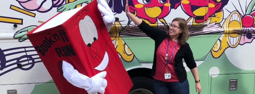 booker high fives sammy in front of the dream bus