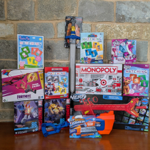 Toys donated by FEH Design. Matching games, Fortnight action figure, Transformers, NERF sword, NERF blaster, NERF super soaker, Monopoly, and My Little Pony toy.